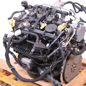 Used Volkswagen Tiguan MK2 2.0L TSI EA888 engine on a pallet, front three-quarter view with intake manifold and wiring loom fitted